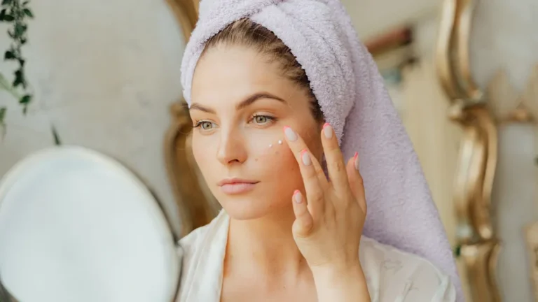 senior woman applying face cream
